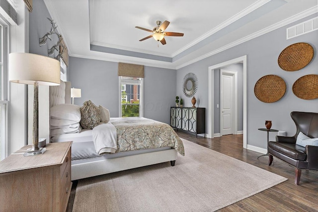 3017 Highland Woods Blvd, New Albany, OH 43054 - bedroom featuring a tray ceiling, wood finished floors, ornamental molding, and a ceiling fan