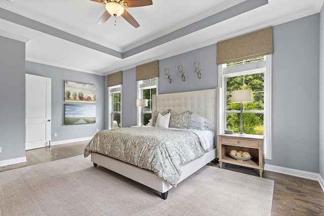 3017 Highland Woods Blvd, New Albany, OH 43054 - bedroom featuring crown molding, a tray ceiling, wood finished floors, and multiple windows