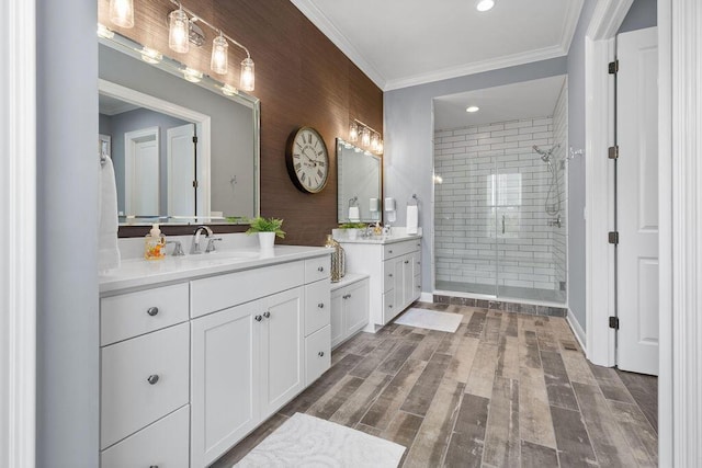 3017 Highland Woods Blvd, New Albany, OH 43054 - full bathroom with a stall shower, two vanities, crown molding, and wood finished floors