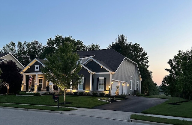 3017 Highland Woods Blvd, New Albany, OH 43054 - craftsman-style house featuring driveway, a front lawn, and an attached garage