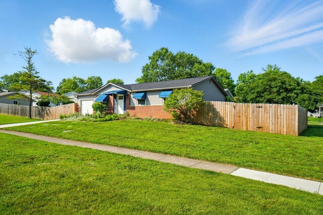 1574 River Bend Rd, Columbus, OH 43223 - ranch-style home featuring a garage, brick siding, and driveway
