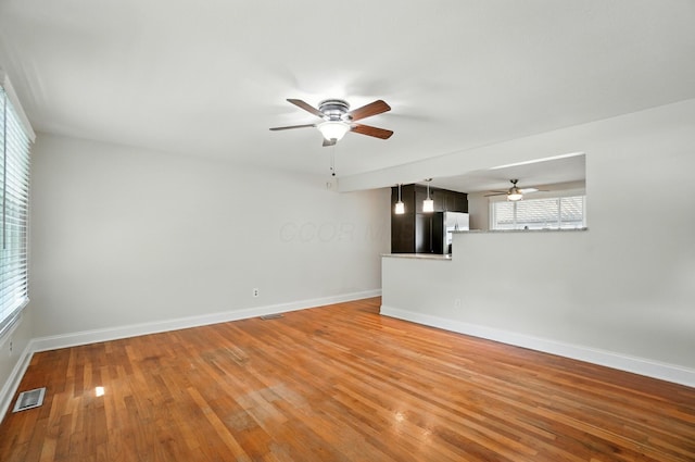 1574 River Bend Rd, Columbus, OH 43223 - unfurnished living room with a ceiling fan and hardwood / wood-style floors