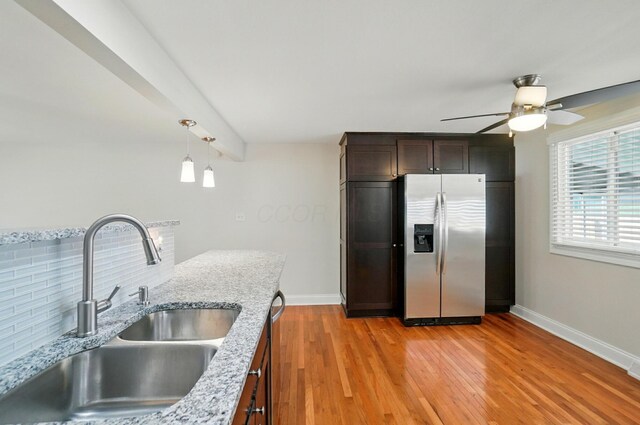1574 River Bend Rd, Columbus, OH 43223 - kitchen featuring stainless steel appliances, a ceiling fan, light wood-style flooring, light stone countertops, and beamed ceiling