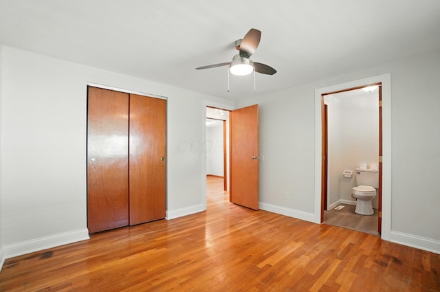 1574 River Bend Rd, Columbus, OH 43223 - unfurnished bedroom with light wood-type flooring, a closet, connected bathroom, and ceiling fan