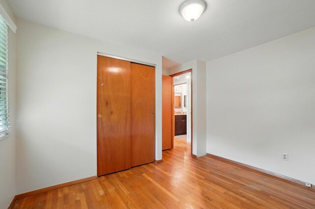 1574 River Bend Rd, Columbus, OH 43223 - unfurnished bedroom featuring a closet and light wood-style floors