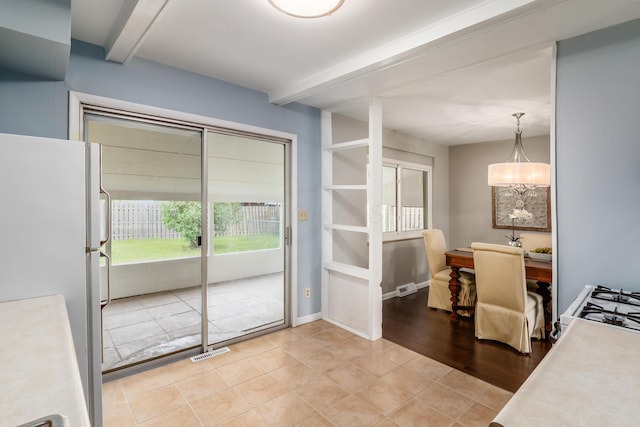 1276 Bryson Rd, Columbus, OH 43224 - dining space featuring beamed ceiling and light tile patterned floors