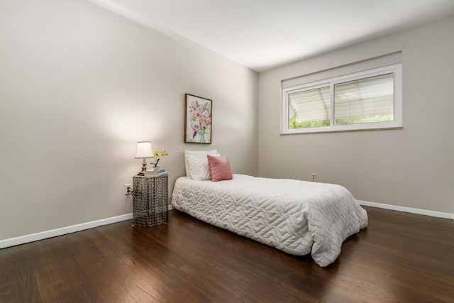 1276 Bryson Rd, Columbus, OH 43224 - bedroom featuring baseboards and wood finished floors