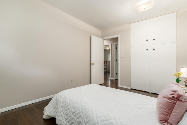 1276 Bryson Rd, Columbus, OH 43224 - bedroom featuring dark wood-style floors and a closet