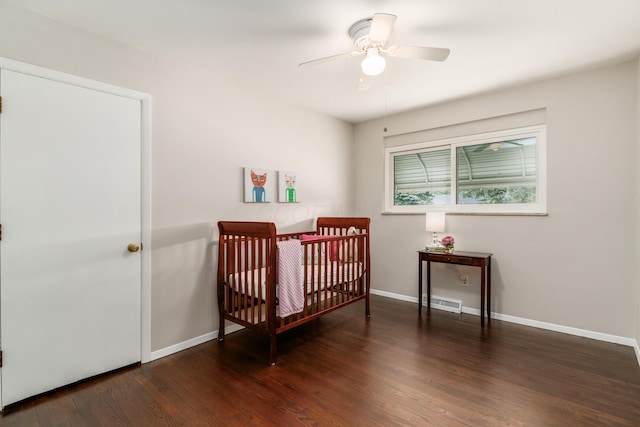 1276 Bryson Rd, Columbus, OH 43224 - bedroom featuring wood finished floors, a nursery area, and a ceiling fan