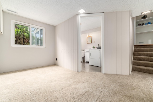 1276 Bryson Rd, Columbus, OH 43224 - carpeted spare room with washer / clothes dryer and stairway