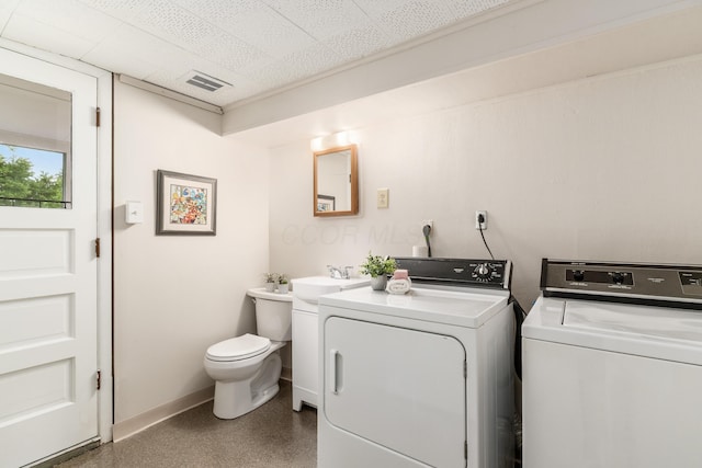 1276 Bryson Rd, Columbus, OH 43224 - laundry room with separate washer and dryer and baseboards