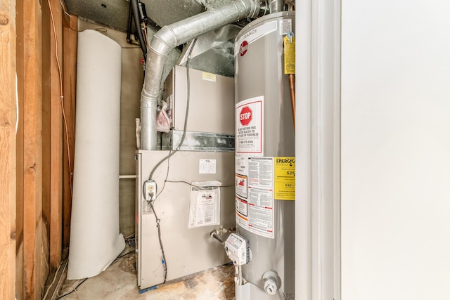 1276 Bryson Rd, Columbus, OH 43224 - utility room with gas water heater and heating unit