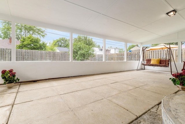 1276 Bryson Rd, Columbus, OH 43224 - unfurnished sunroom featuring vaulted ceiling