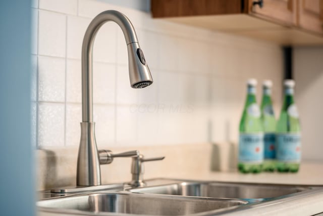 1276 Bryson Rd, Columbus, OH 43224 - kitchen view of a sink and white cabinetry