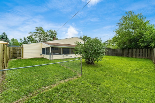 1276 Bryson Rd, Columbus, OH 43224 - fenced backyard with a sunroom
