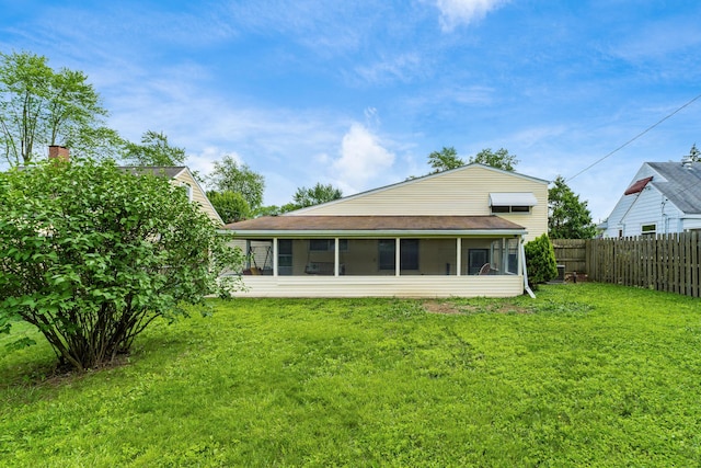 1276 Bryson Rd, Columbus, OH 43224 - rear view of property with a sunroom and a chimney