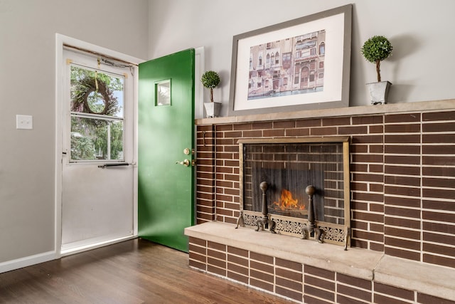 1276 Bryson Rd, Columbus, OH 43224 - detailed view of a lit fireplace and wood finished floors