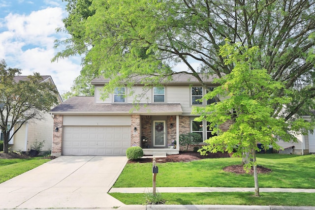 5983 Epernay Way, Galloway, OH 43119 - traditional-style home featuring driveway, a garage, a front lawn, brick siding, and roof with shingles