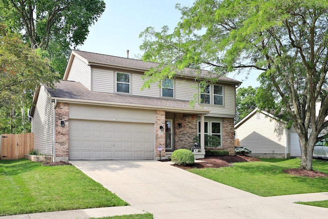 5983 Epernay Way, Galloway, OH 43119 - traditional home with brick siding, concrete driveway, and an attached garage