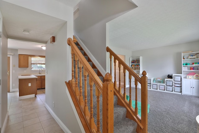 5983 Epernay Way, Galloway, OH 43119 - staircase featuring tile patterned flooring and baseboards