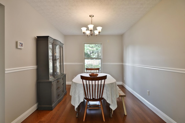 5983 Epernay Way, Galloway, OH 43119 - dining room featuring a chandelier, dark wood-style flooring, and a textured ceiling