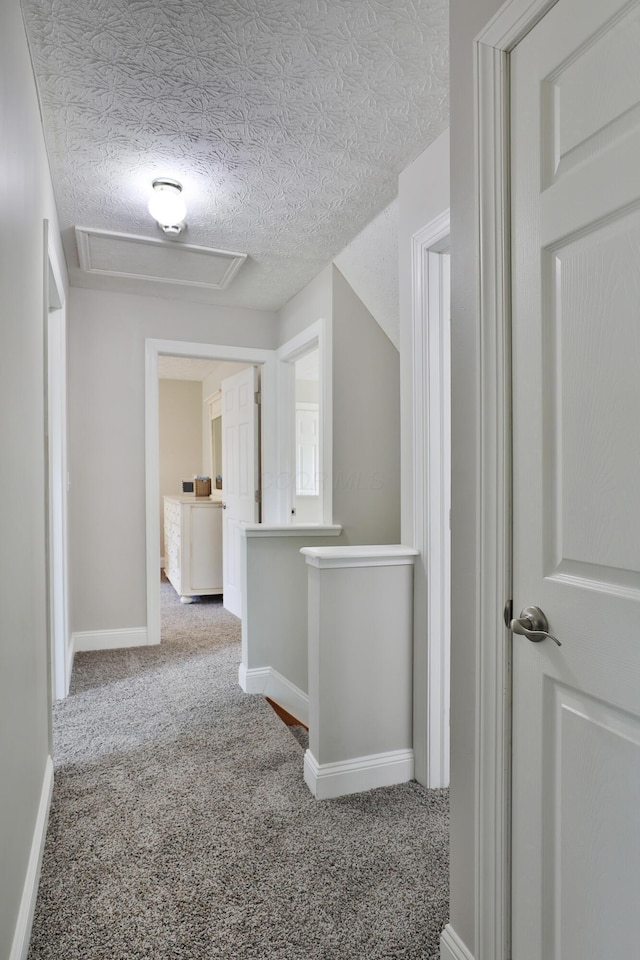 5983 Epernay Way, Galloway, OH 43119 - hallway featuring attic access, carpet floors, and a textured ceiling