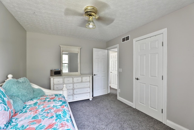 5983 Epernay Way, Galloway, OH 43119 - bedroom with dark colored carpet, a textured ceiling, and ceiling fan