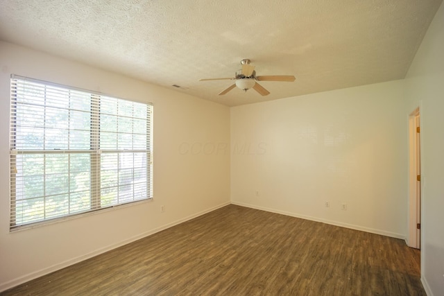 147 Shadymere Ln, Columbus, OH 43213 - unfurnished room with ceiling fan, dark wood-style flooring, and a textured ceiling