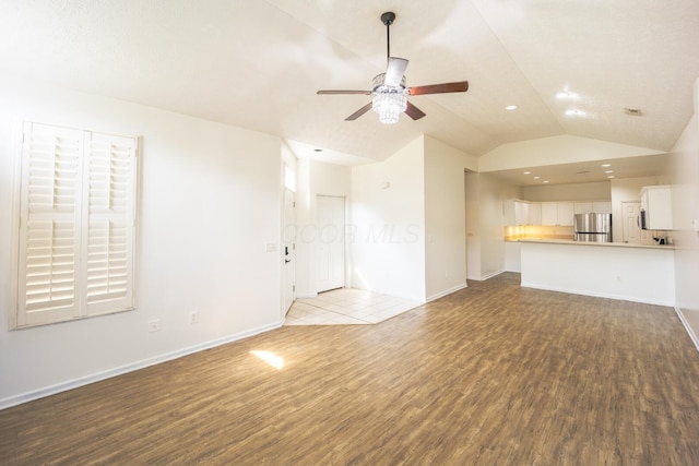 147 Shadymere Ln, Columbus, OH 43213 - unfurnished living room featuring wood finished floors, ceiling fan, lofted ceiling, and recessed lighting