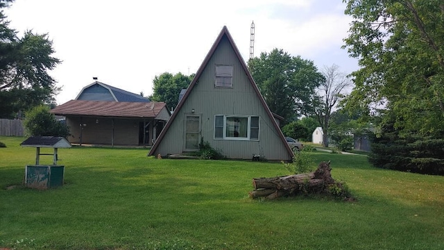 103 Center St, Waldo, OH 43356 - back of house featuring a yard