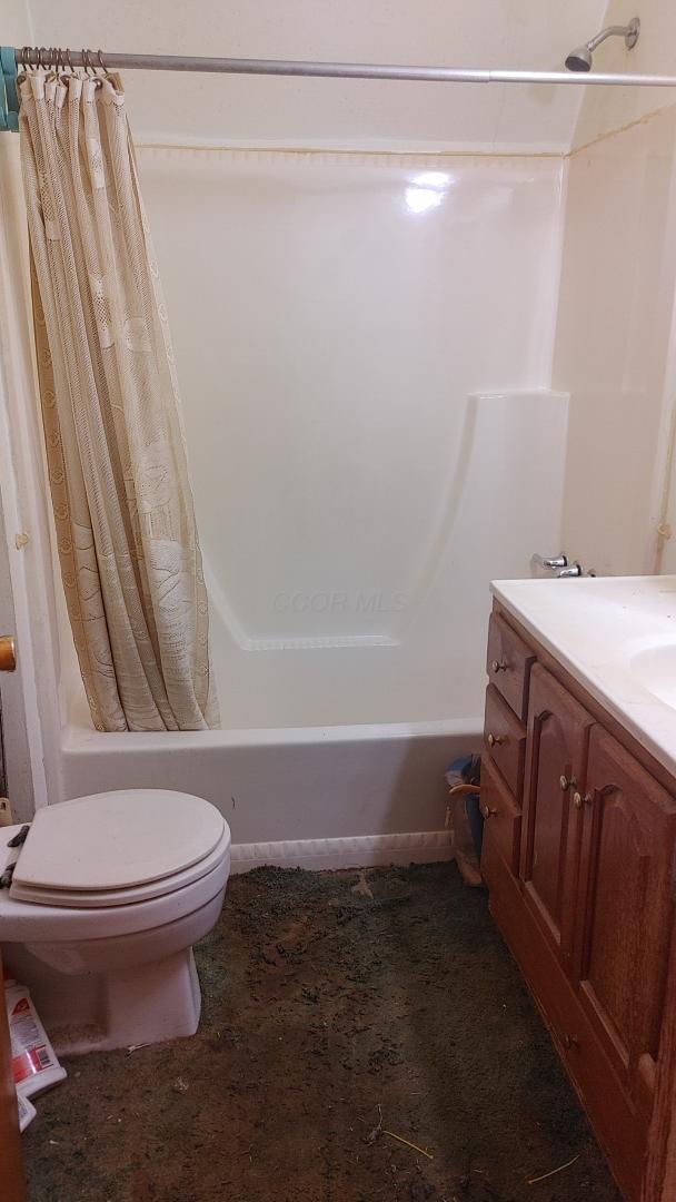 103 Center St, Waldo, OH 43356 - full bathroom with shower / bathtub combination with curtain and vanity