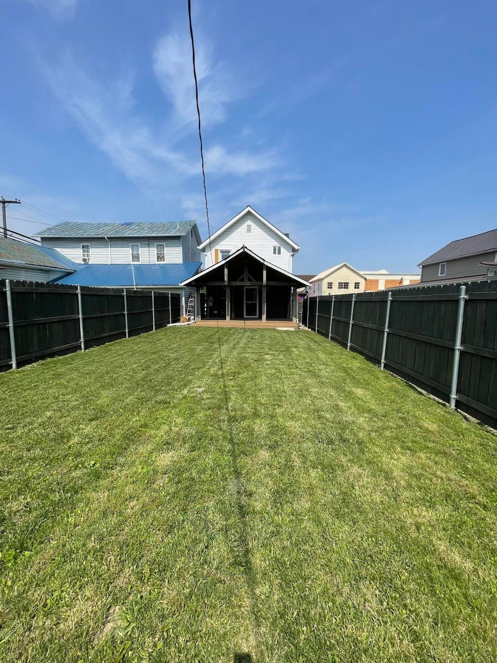 212 S Pickaway St, Circleville, OH 43113 - rear view of property with a fenced backyard