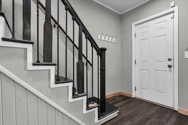 212 S Pickaway St, Circleville, OH 43113 - foyer entrance with dark wood-type flooring, crown molding, and stairway