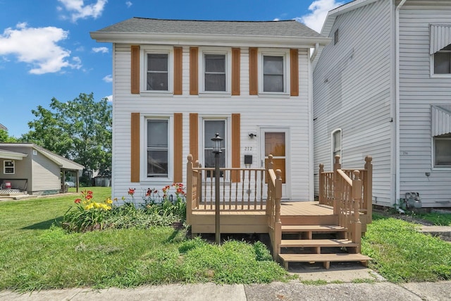 212 S Pickaway St, Circleville, OH 43113 - view of front of property with a deck and roof with shingles