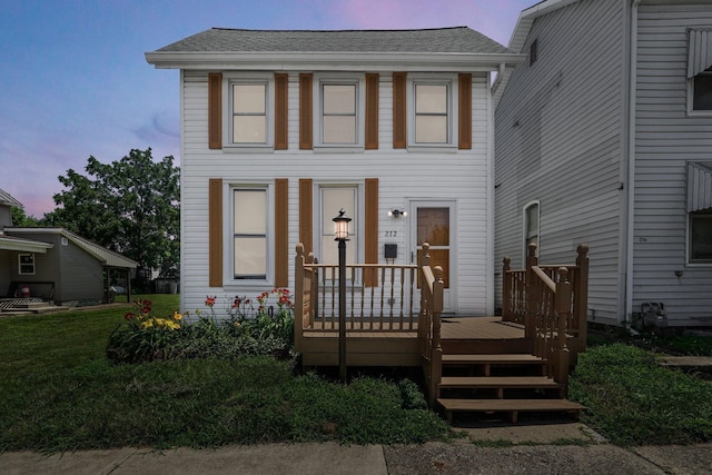 212 S Pickaway St, Circleville, OH 43113 - view of front of property with a deck and a shingled roof