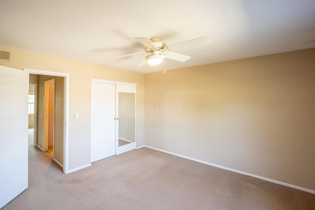 83 Tarryton Ct W, Columbus, OH 43228 - unfurnished bedroom with light colored carpet, a closet, and a ceiling fan