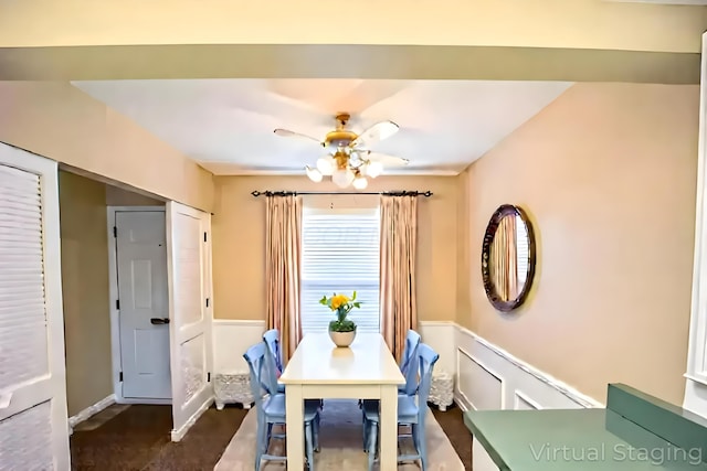 83 Tarryton Ct W, Columbus, OH 43228 - dining area with wainscoting, a ceiling fan, and a decorative wall