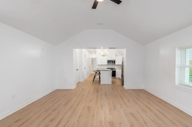 165 W Jersey St, Johnstown, OH 43031 - unfurnished living room with a chandelier, light wood-style flooring, vaulted ceiling, and ceiling fan