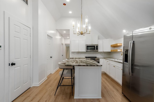 165 W Jersey St, Johnstown, OH 43031 - kitchen with appliances with stainless steel finishes, tasteful backsplash, open shelves, stone countertops, and a chandelier