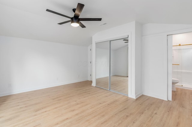 165 W Jersey St, Johnstown, OH 43031 - unfurnished bedroom featuring lofted ceiling, light wood finished floors, ensuite bath, a ceiling fan, and a closet