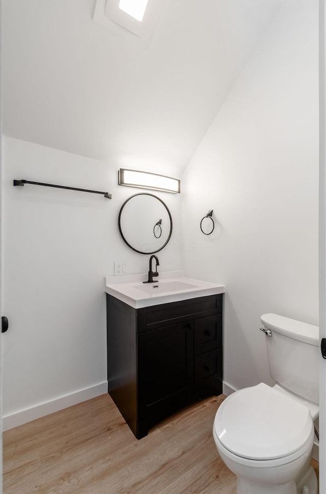 165 W Jersey St, Johnstown, OH 43031 - half bath with vanity, wood finished floors, and lofted ceiling