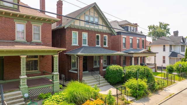 56 S Champion Ave, Columbus, OH 43205 - view of front of house with a porch and brick siding