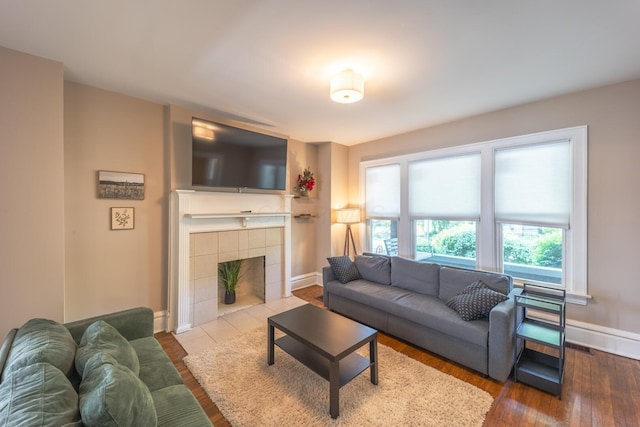 56 S Champion Ave, Columbus, OH 43205 - living area with a tiled fireplace and wood finished floors