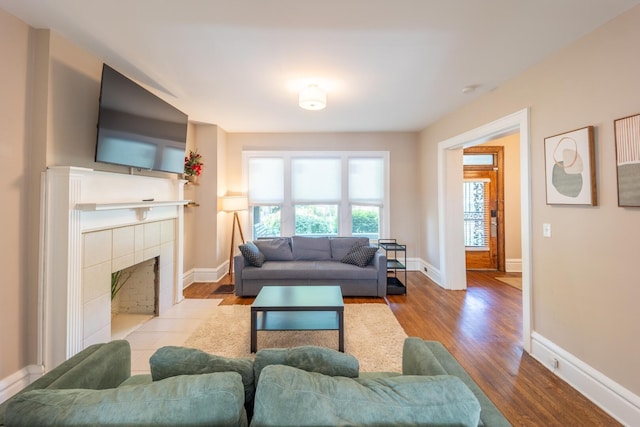 56 S Champion Ave, Columbus, OH 43205 - living room featuring wood finished floors and a tiled fireplace