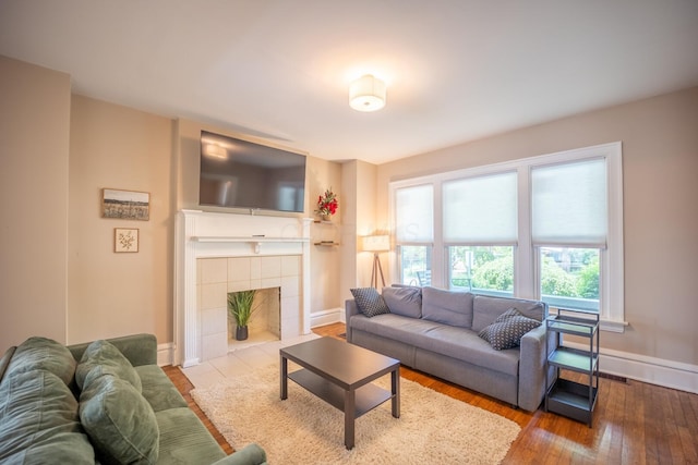 56 S Champion Ave, Columbus, OH 43205 - living room with wood finished floors and a tile fireplace