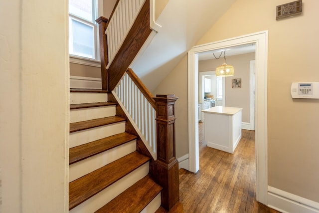 56 S Champion Ave, Columbus, OH 43205 - stairs with hardwood / wood-style flooring and lofted ceiling
