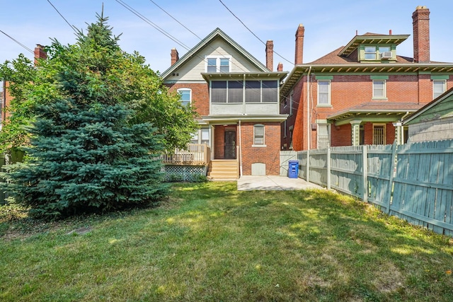56 S Champion Ave, Columbus, OH 43205 - rear view of house featuring brick siding and a chimney