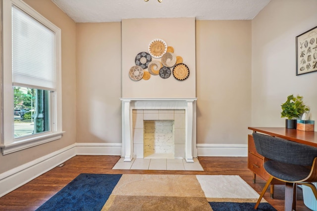 56 S Champion Ave, Columbus, OH 43205 - living area featuring wood finished floors and a fireplace