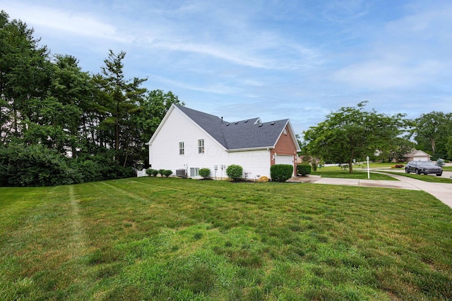 6838 Evergreen Cir, Dayton, OH 45424 - view of home's exterior with driveway, a yard, and a shingled roof