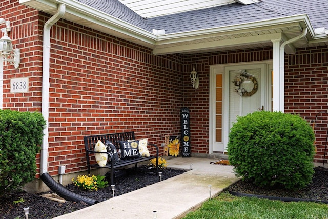 6838 Evergreen Cir, Dayton, OH 45424 - property entrance featuring roof with shingles and brick siding